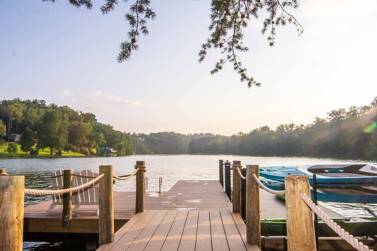 Wooden dock on Lake Stevens at golden hour with forested shoreline