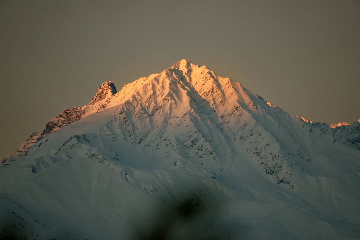 Snow-capped Cascades foothills above the Marysville valley at golden hour