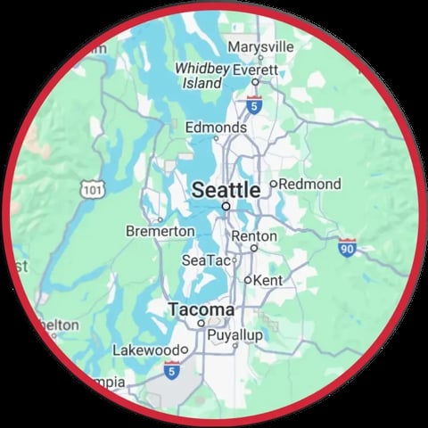 Map of Seattle and surrounding Washington cities including Tacoma, Edmonds, and Redmond within a red circle border